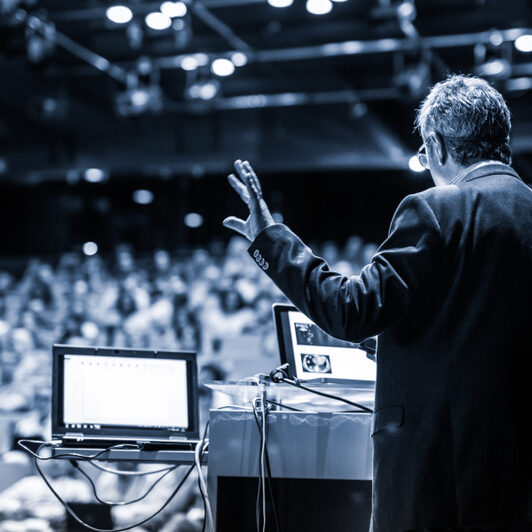 Speaker,Giving,A,Talk,On,Corporate,Business,Conference.,Unrecognizable,People