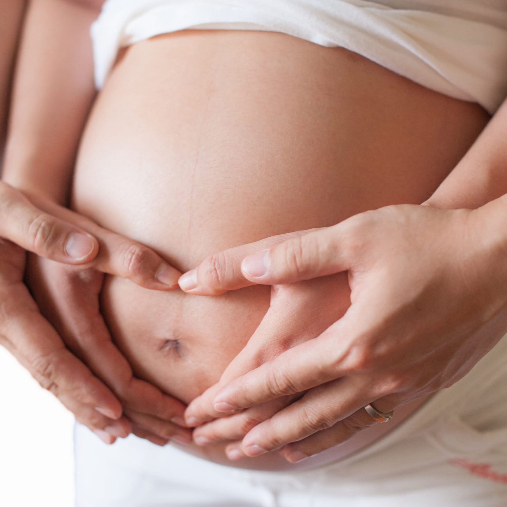 Pregnant,Woman,And,Her,Husband,Holding,Hand,Together,,2,Hands