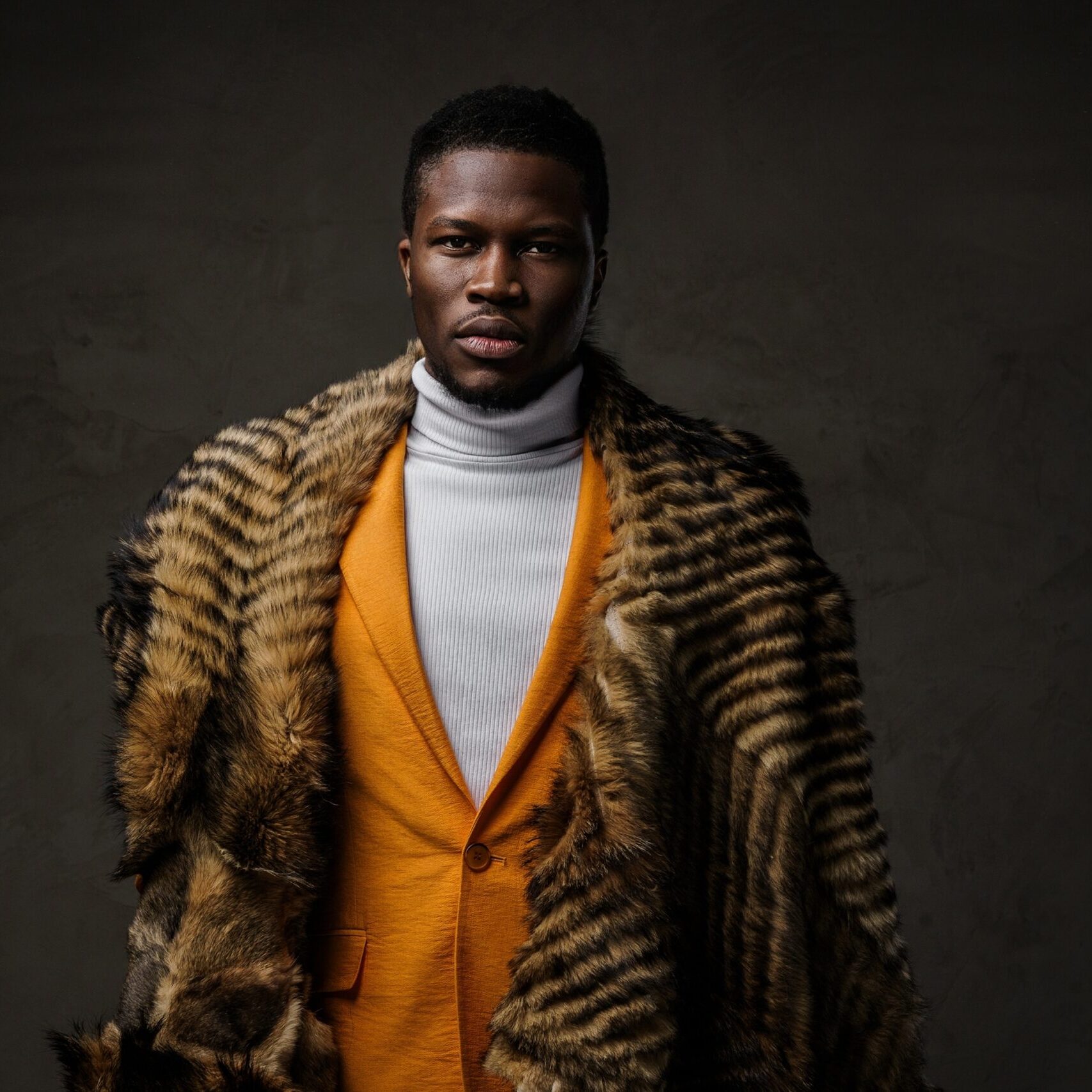 Portrait,Of,A,Stylish,Dark-skinned,Man,Wearing,A,Yellow,Jacket